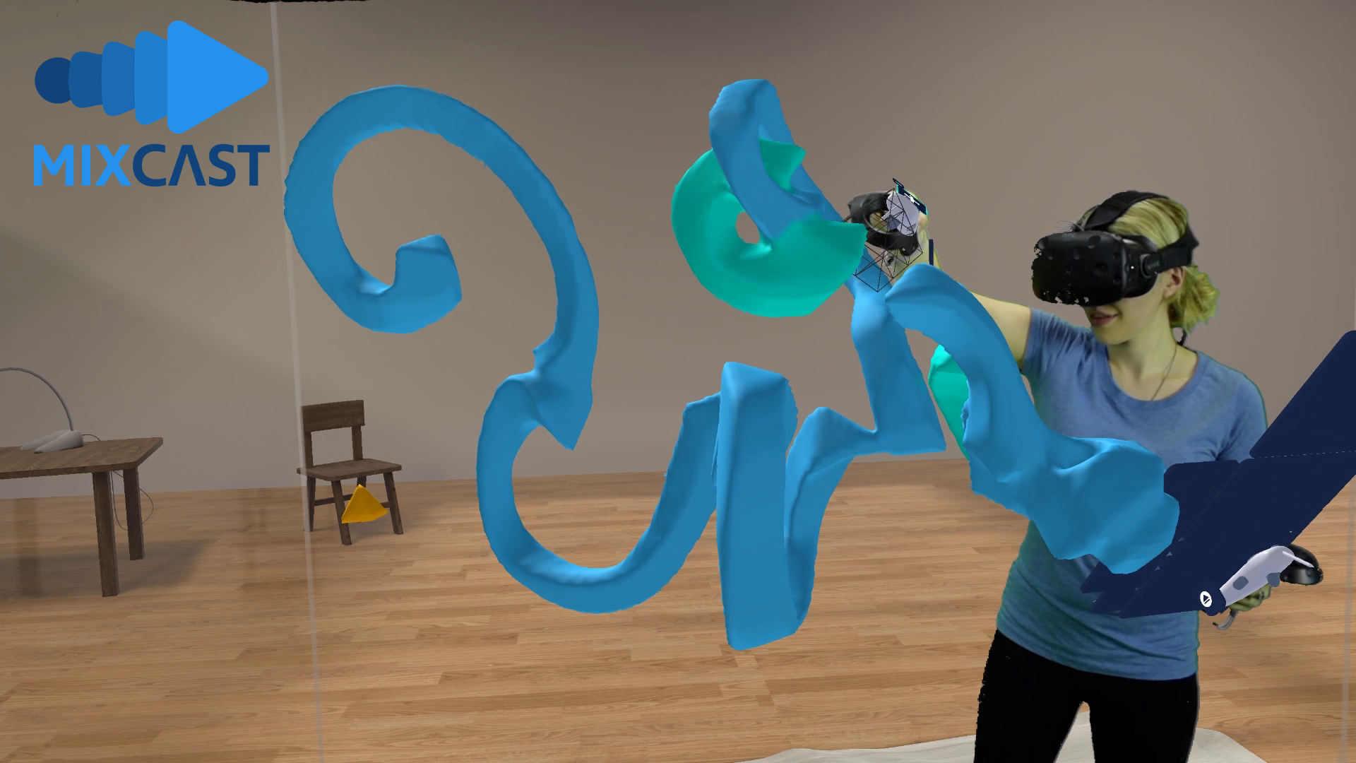 A female artist sculpts abstract forms inside the virtual reality application, MasterpieceVR